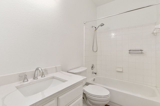 full bathroom with toilet, tiled shower / bath combo, and vanity