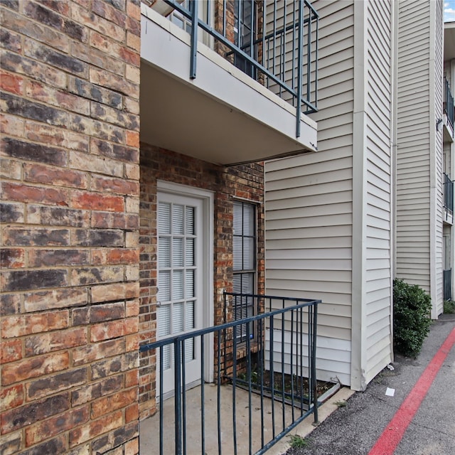 property entrance with a balcony