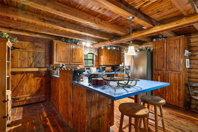 kitchen with beamed ceiling, stainless steel fridge, and dark wood-type flooring