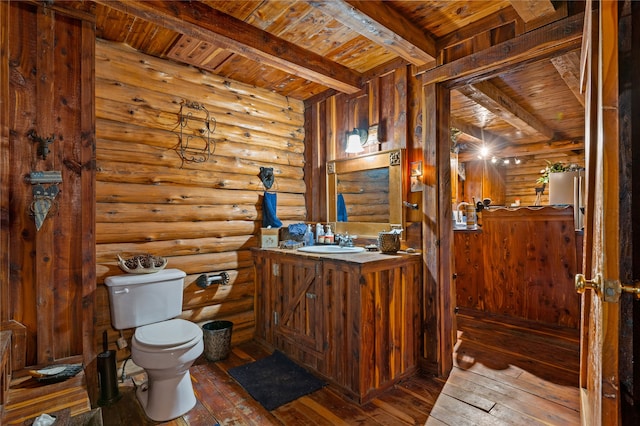 bathroom featuring hardwood / wood-style floors, beamed ceiling, toilet, and wooden ceiling