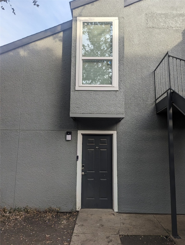 doorway to property featuring a balcony