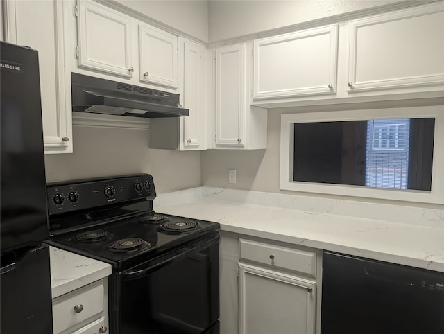 kitchen featuring white cabinetry, black appliances, and light stone counters