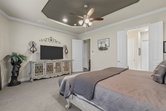 bedroom with ornamental molding, a raised ceiling, ceiling fan, and carpet floors