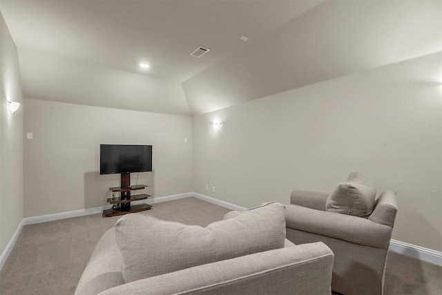 living room with light colored carpet and lofted ceiling