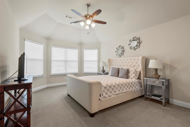 carpeted bedroom with vaulted ceiling and ceiling fan