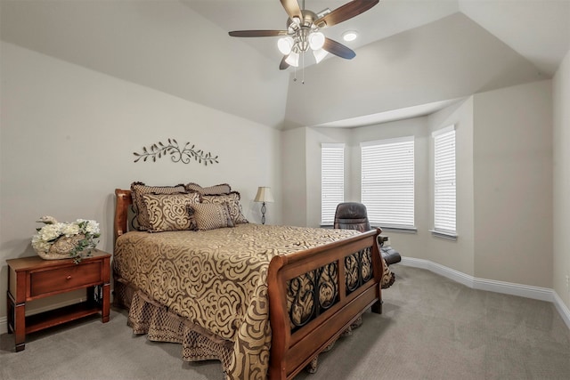 bedroom featuring vaulted ceiling, light carpet, and ceiling fan