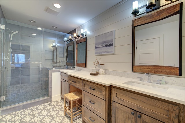 bathroom featuring tile patterned flooring, vanity, and an enclosed shower