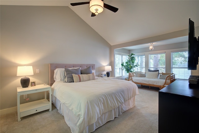 bedroom with ceiling fan, light carpet, and high vaulted ceiling