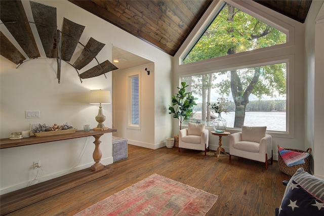 living area featuring vaulted ceiling, a water view, dark hardwood / wood-style floors, and wood ceiling