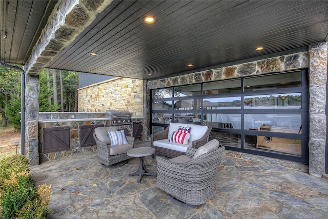 view of patio with outdoor lounge area and a grill