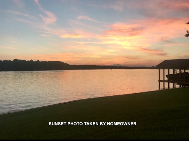 property view of water featuring a boat dock