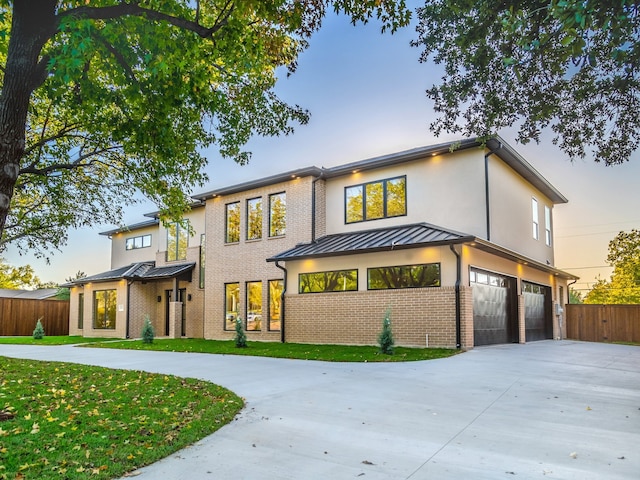 view of front of house with a lawn and a garage