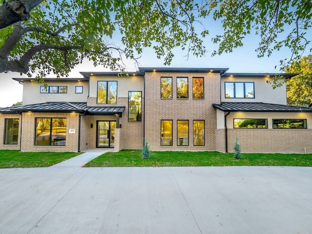 rear view of property featuring a yard