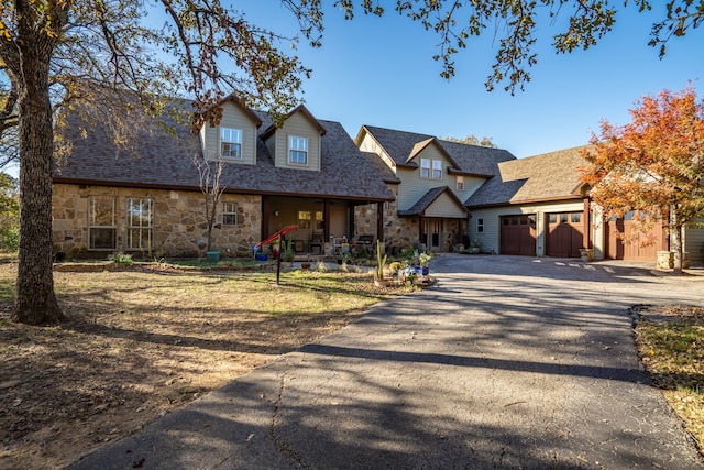 cape cod-style house with a garage