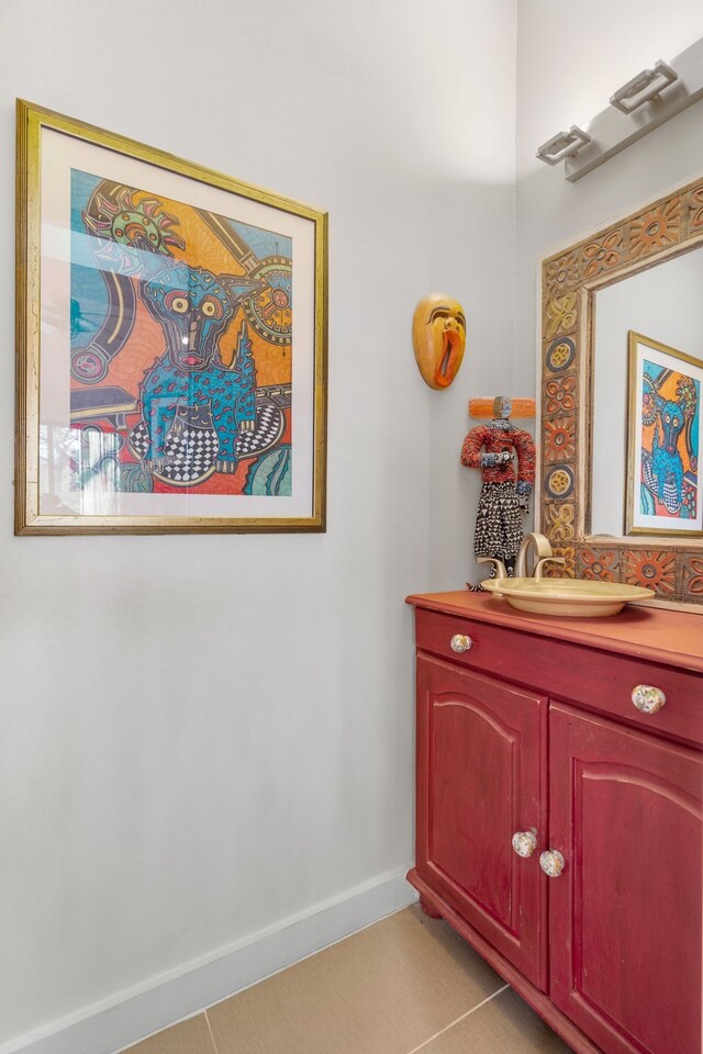 bathroom with vanity and tile patterned floors