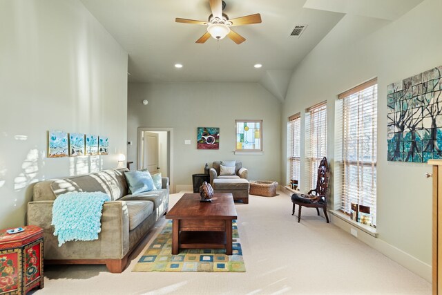 living room with ceiling fan, carpet, and vaulted ceiling