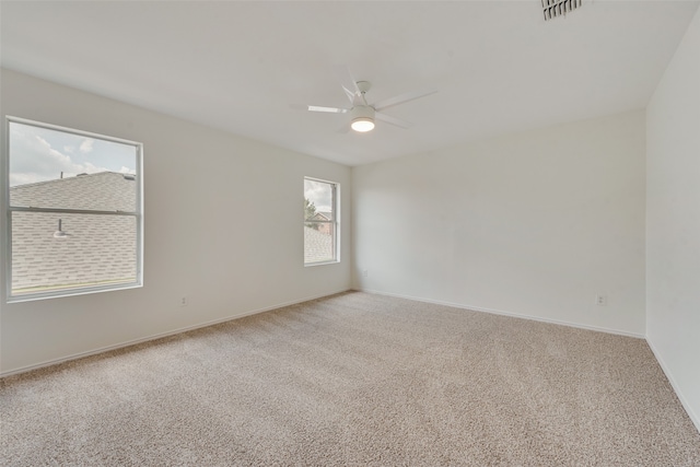 carpeted empty room with ceiling fan