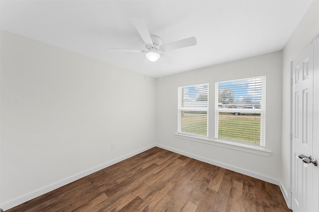 unfurnished room with hardwood / wood-style flooring and ceiling fan