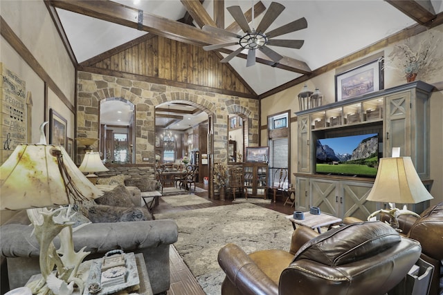 living room with high vaulted ceiling, hardwood / wood-style floors, ceiling fan, and beam ceiling