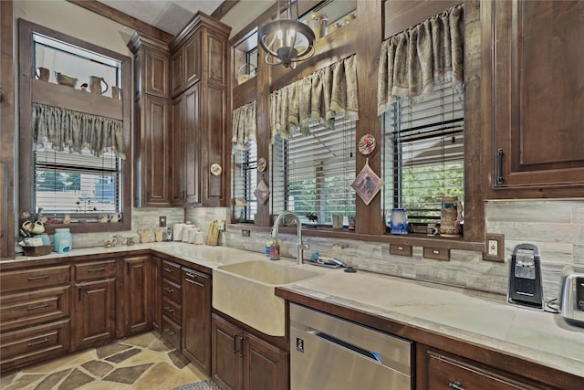 kitchen with dishwasher, tasteful backsplash, a wealth of natural light, and sink