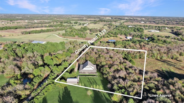 drone / aerial view featuring a water view and a rural view