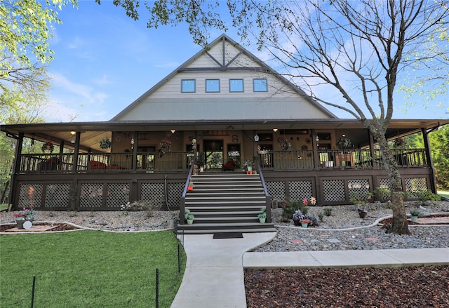 farmhouse inspired home featuring a front yard and a wooden deck