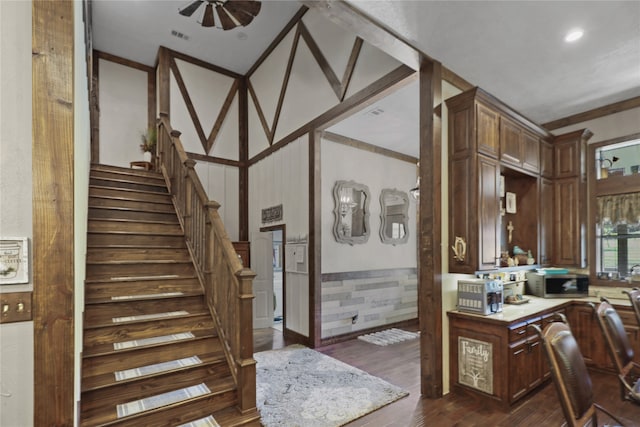 interior space featuring dark wood-type flooring and ceiling fan