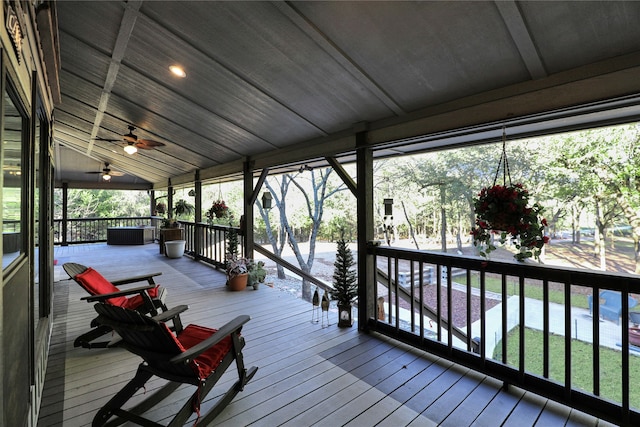 wooden terrace featuring ceiling fan