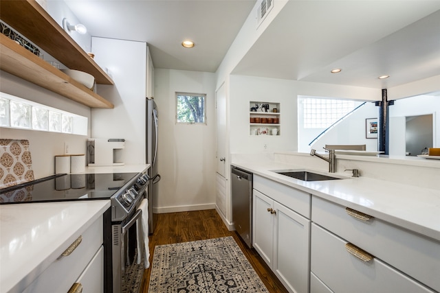 kitchen featuring white cabinetry, sink, dark hardwood / wood-style floors, and stainless steel appliances