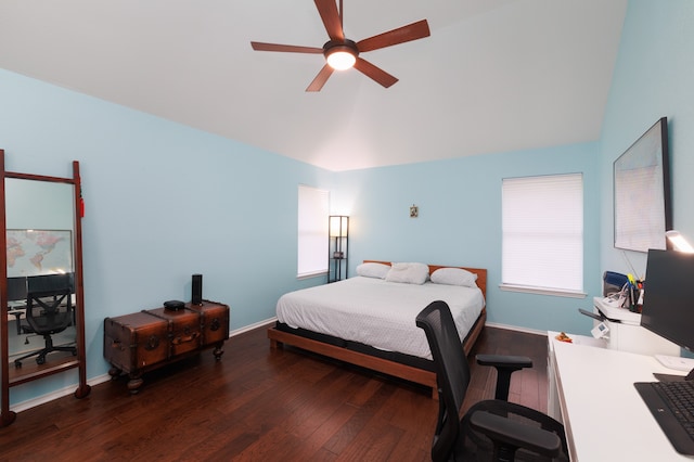 bedroom with vaulted ceiling, ceiling fan, and dark hardwood / wood-style flooring