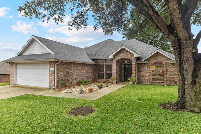 single story home featuring a garage and a front yard