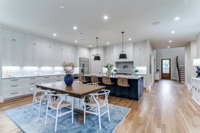 dining room with light wood-type flooring