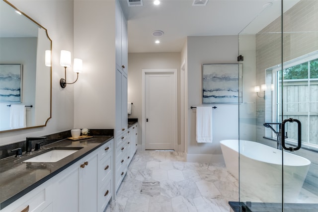 bathroom with vanity and a bathing tub