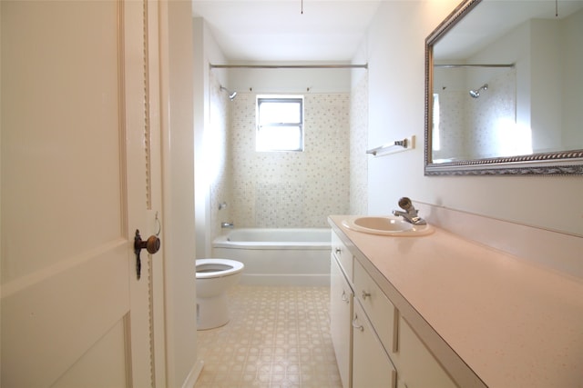 full bathroom with vanity, toilet, and tiled shower / bath combo