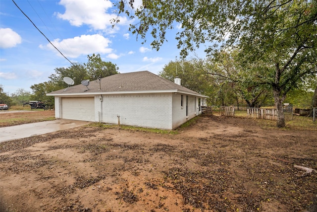 view of side of property featuring a garage