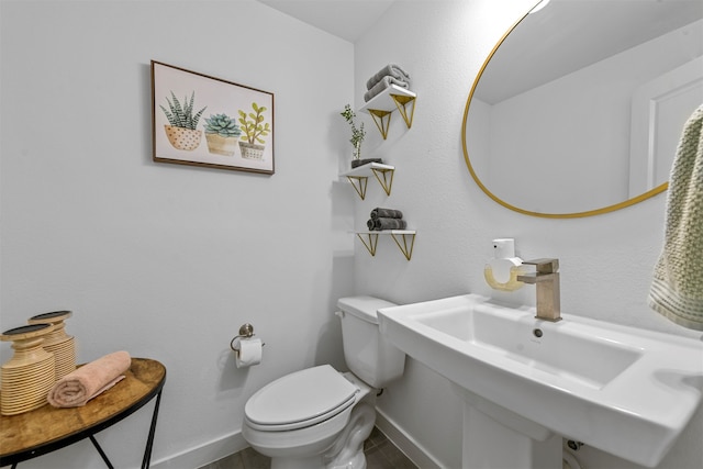 bathroom featuring sink and toilet