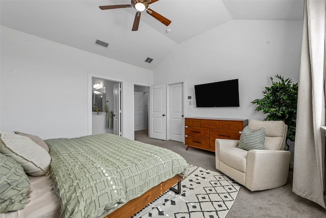 carpeted bedroom with connected bathroom, high vaulted ceiling, and ceiling fan