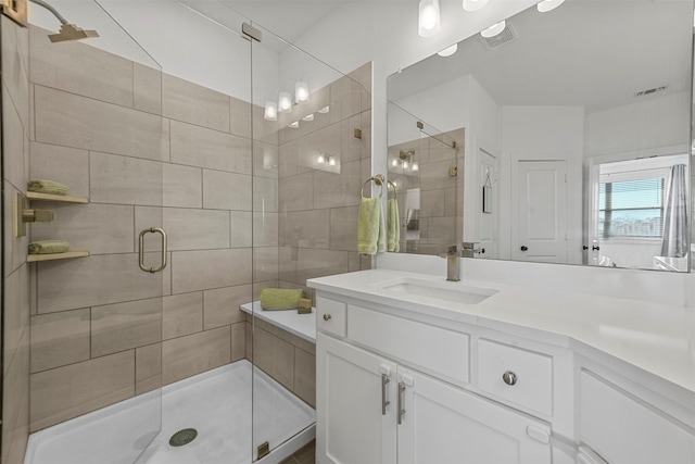 bathroom with vanity and an enclosed shower