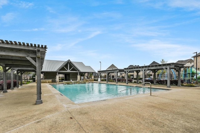 view of pool with a patio and a pergola