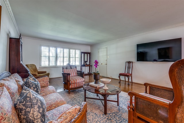 living room with wood-type flooring and crown molding