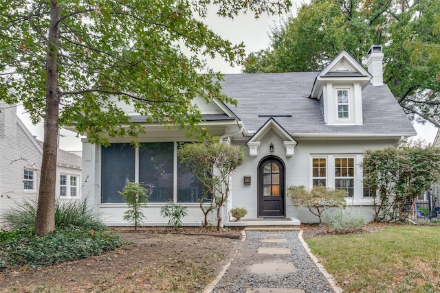 view of front of property with a front lawn and a chimney