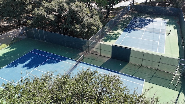 view of sport court with fence