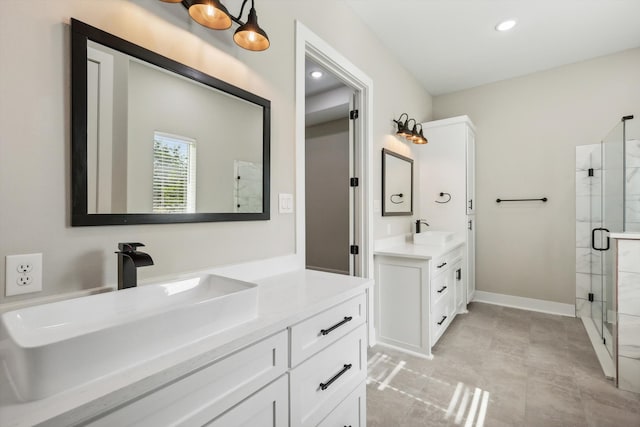 bathroom with walk in shower and vanity