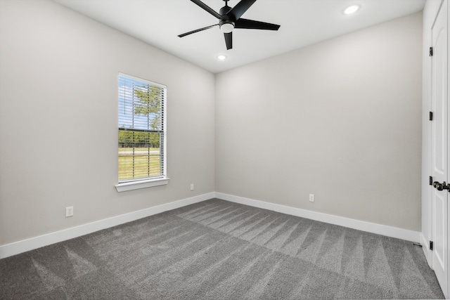 empty room featuring carpet floors and ceiling fan