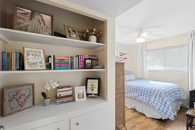 bedroom with hardwood / wood-style floors and ceiling fan