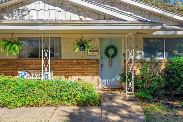 doorway to property with a porch