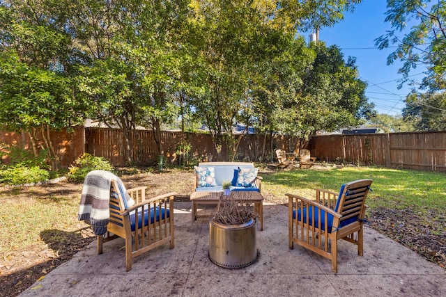 view of patio / terrace featuring an outdoor fire pit