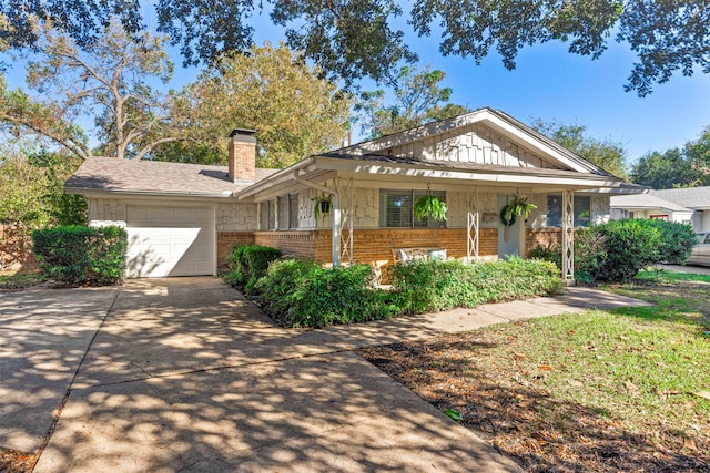 view of front facade with a garage and a porch