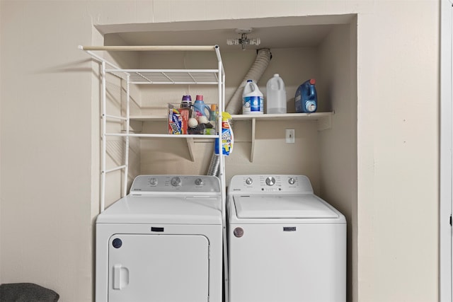 laundry area with washing machine and clothes dryer