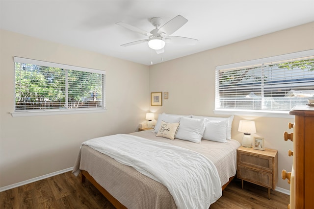 bedroom featuring ceiling fan and dark hardwood / wood-style flooring